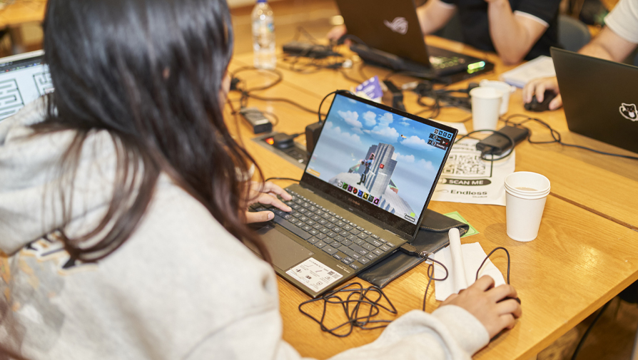 student playing a game on a laptop