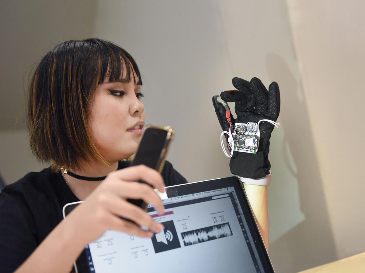 ame showcase student with digital glove